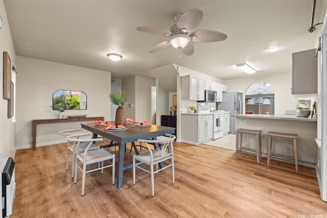 94-547 Lumiauau St, Waipahu, HI 96797 - dining space with light wood-style flooring, ceiling fan, and heating unit