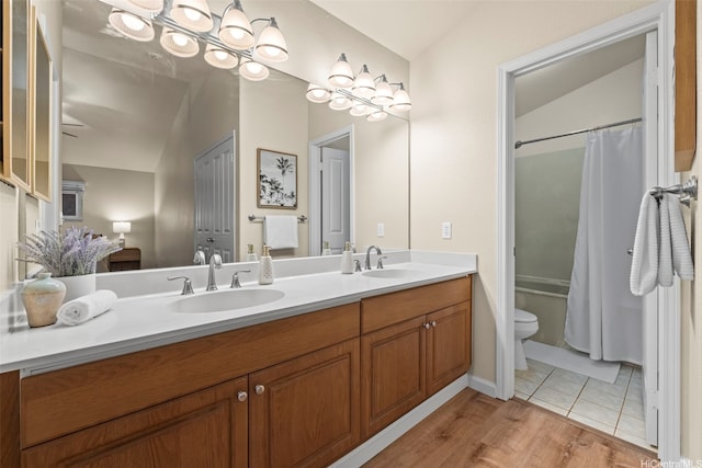 94-547 Lumiauau St, Waipahu, HI 96797 - full bathroom with double vanity, shower / tub combo, vaulted ceiling, and wood finished floors