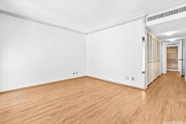 1600 Ala Moana Blvd Unit 306, Honolulu, HI 96815 - unfurnished room with a textured ceiling and wood finished floors