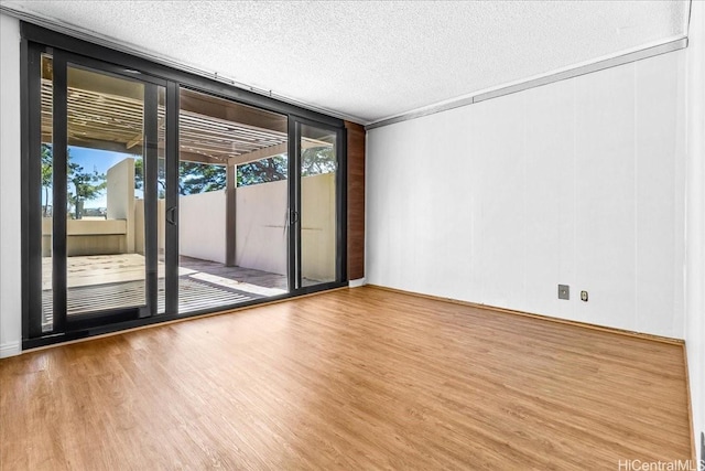 1600 Ala Moana Blvd Unit 306, Honolulu, HI 96815 - empty room featuring wood finished floors and a textured ceiling