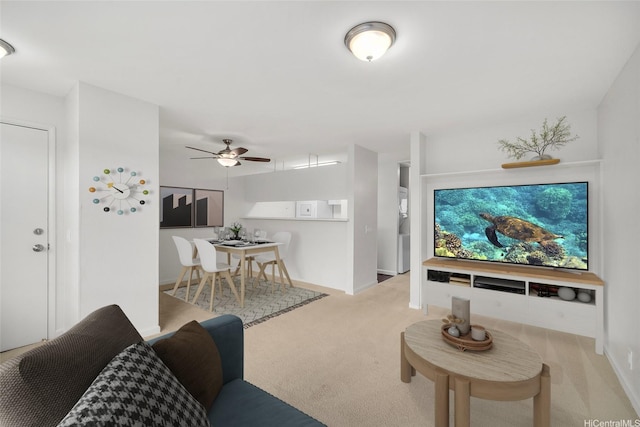 46-267 Kahuhipa St Unit C303, Kaneohe, HI 96744 - carpeted living room featuring ceiling fan and baseboards