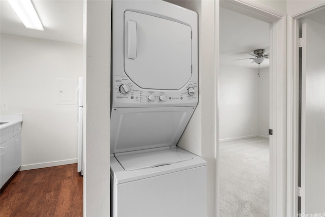 46-267 Kahuhipa St Unit C303, Kaneohe, HI 96744 - laundry room with stacked washer and clothes dryer, a ceiling fan, and dark wood-style flooring