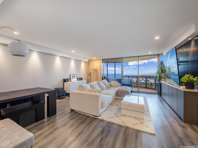 415 S St Unit 1602, Honolulu, HI 96813 - living room with a wall of windows, wood finished floors, and recessed lighting
