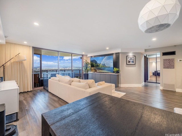 415 S St Unit 1602, Honolulu, HI 96813 - living room with wood finished floors, a wall of windows, and recessed lighting