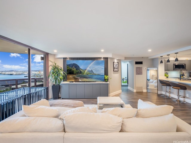 415 S St Unit 1602, Honolulu, HI 96813 - living area with dark wood-style flooring, a water view, recessed lighting, and a wall of windows