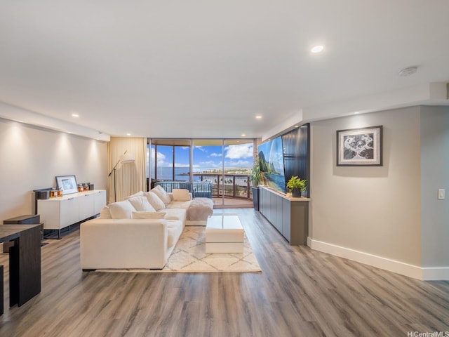 415 S St Unit 1602, Honolulu, HI 96813 - living area with expansive windows, wood finished floors, and recessed lighting