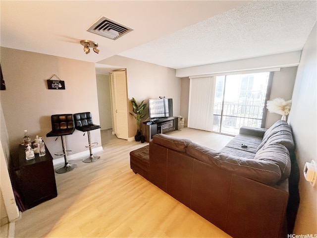 225 Queen St Unit 14A, Honolulu, HI 96813 - living area featuring light wood-style floors