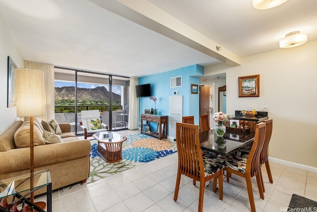 229 Paoakalani Ave Unit 1014, Honolulu, HI 96815 - dining room with expansive windows and light tile patterned flooring