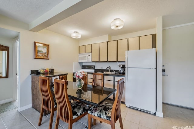 229 Paoakalani Ave Unit 1014, Honolulu, HI 96815 - dining space with a textured ceiling and light tile patterned floors