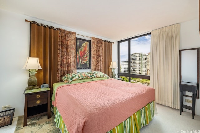 229 Paoakalani Ave Unit 1014, Honolulu, HI 96815 - bedroom featuring light colored carpet and expansive windows