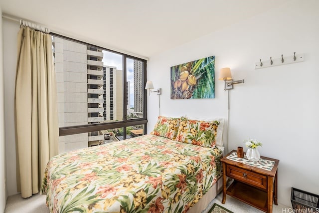 229 Paoakalani Ave Unit 1014, Honolulu, HI 96815 - bedroom with carpet flooring and a wall of windows