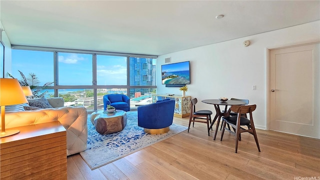 1177 Queen St Unit 1805, Honolulu, HI 96814 - living area with wood finished floors and a wall of windows