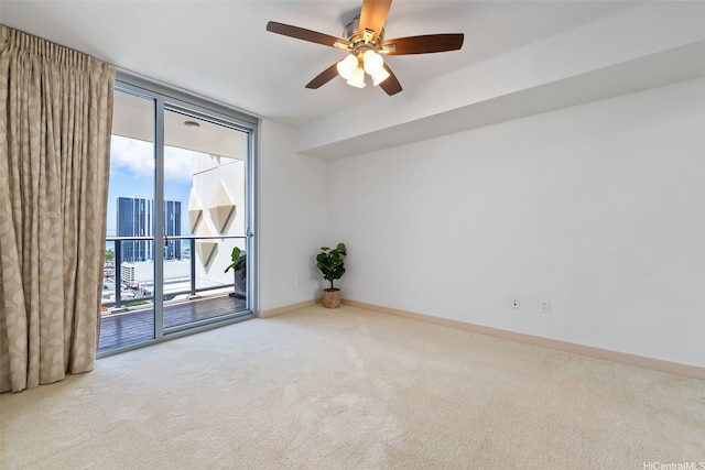 555 S St Unit 2303, Honolulu, HI 96813 - unfurnished room featuring carpet, expansive windows, and a ceiling fan