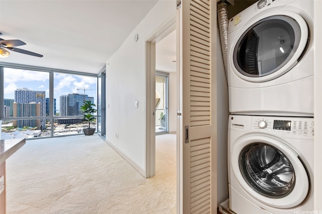 555 S St Unit 2303, Honolulu, HI 96813 - washroom with stacked washer / drying machine, carpet flooring, ceiling fan, and a view of skyline