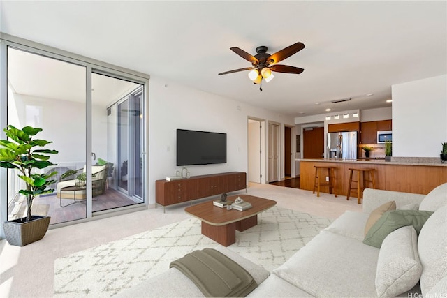 555 S St Unit 2303, Honolulu, HI 96813 - living room with light colored carpet, a ceiling fan, and recessed lighting