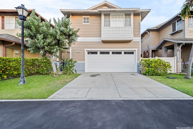 91-3082 Makalea Loop Unit 41, Ewa Beach, HI 96706 - view of front of house with an attached garage, concrete driveway, and a front lawn