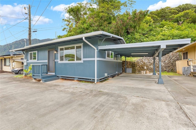 45-860 Anoi Rd Unit 5, Kaneohe, HI 96744 - view of front of house featuring concrete driveway and a carport