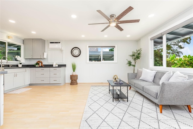 45-860 Anoi Rd Unit 5, Kaneohe, HI 96744 - living area with light wood-type flooring, ceiling fan, recessed lighting, and a wall unit AC