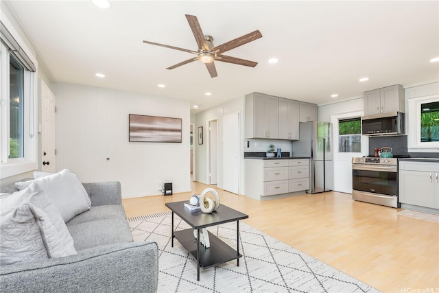 45-860 Anoi Rd Unit 5, Kaneohe, HI 96744 - living area with ceiling fan, light wood-style floors, and recessed lighting