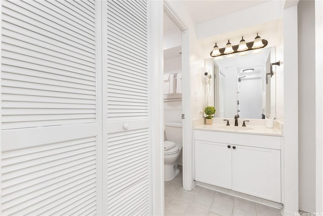 2450 Prince Edward St Unit 506A, Honolulu, HI 96815 - bathroom featuring a closet, vanity, and tile patterned floors