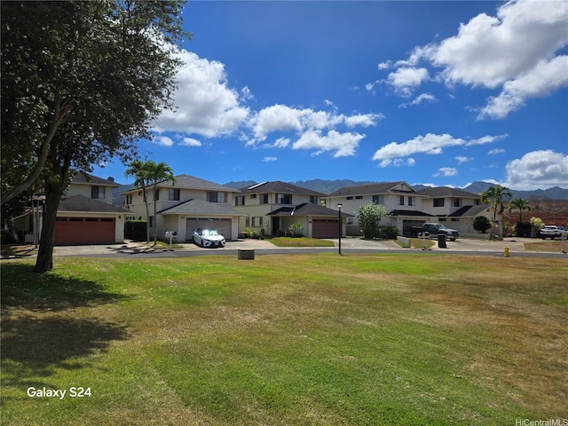 94-1008 Makakoa Loop, Waipahu, HI 96797 - view of green lawn with a residential view and a garage