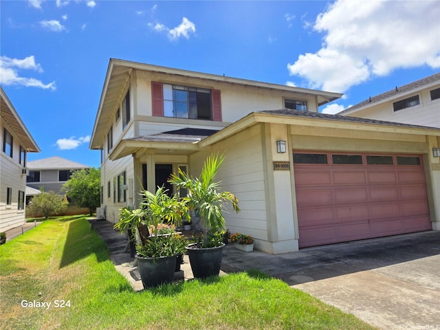 94-1008 Makakoa Loop, Waipahu, HI 96797 - view of front of house with driveway, a front lawn, and an attached garage