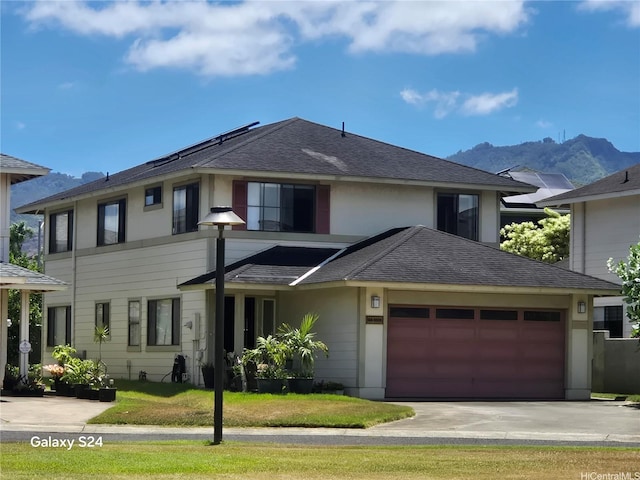 94-1008 Makakoa Loop, Waipahu, HI 96797 - view of front of property featuring roof with shingles, driveway, an attached garage, a mountain view, and stucco siding