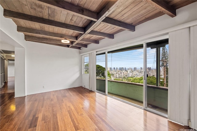2316 Round Top Dr, Honolulu, HI 96822 - empty room featuring a skyline view, a wooden ceiling with exposed beams, wood finished floors, and plenty of natural light