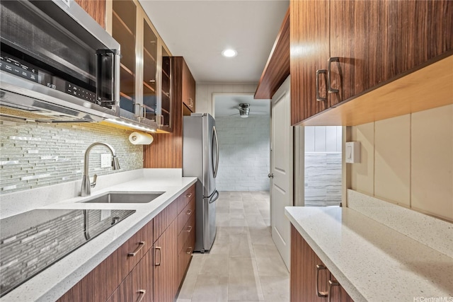 2316 Round Top Dr, Honolulu, HI 96822 - kitchen featuring appliances with stainless steel finishes, a ceiling fan, light tile patterned floors, light stone countertops, and recessed lighting