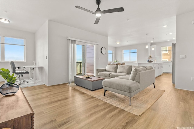 91-3575 Iwikuamoo St Unit 501, Ewa Beach, HI 96706 - living room featuring light wood finished floors, ceiling fan, healthy amount of natural light, and recessed lighting