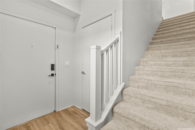 91-3575 Iwikuamoo St Unit 501, Ewa Beach, HI 96706 - foyer featuring stairway and wood finished floors