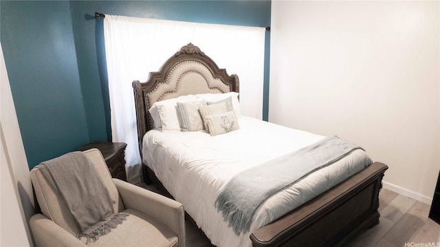 91-950 Laaulu St Unit 42E, Ewa Beach, HI 96706 - bedroom with wood finished floors and baseboards