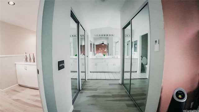 91-950 Laaulu St Unit 42E, Ewa Beach, HI 96706 - corridor with wood finished floors and vaulted ceiling