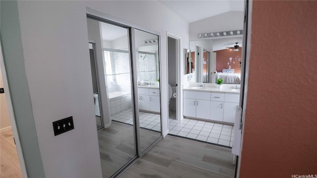 91-950 Laaulu St Unit 42E, Ewa Beach, HI 96706 - full bathroom featuring vanity, wood finished floors, and ceiling fan
