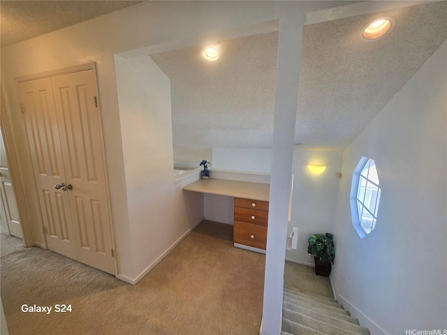 94-1060 Lelehu St, Waipahu, HI 96797 - hallway featuring light carpet, a textured ceiling, a desk, and recessed lighting