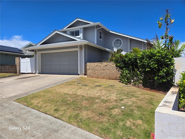 94-1060 Lelehu St, Waipahu, HI 96797 - view of front of home with driveway, board and batten siding, and a garage