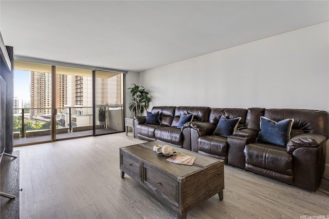 1860 Ala Moana Blvd Unit 1208, Honolulu, HI 96815 - living area featuring wood finished floors, floor to ceiling windows, and a city view