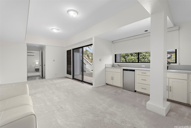 1789 Laukahi St, Honolulu, HI 96821 - kitchen featuring light colored carpet, light countertops, white cabinets, and a wall mounted AC