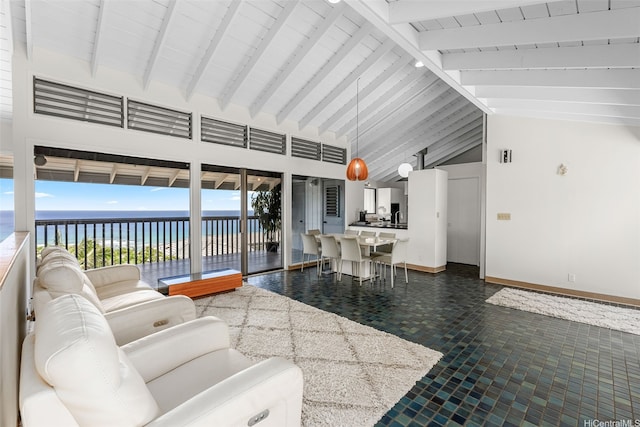 1789 Laukahi St, Honolulu, HI 96821 - living area featuring view of water and beach, beam ceiling, and high vaulted ceiling