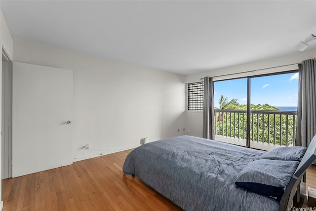 1789 Laukahi St, Honolulu, HI 96821 - bedroom with wood finished floors and access to outside