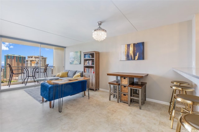 400 Hobron Ln Unit 2809, Honolulu, HI 96815 - living room featuring a chandelier and baseboards