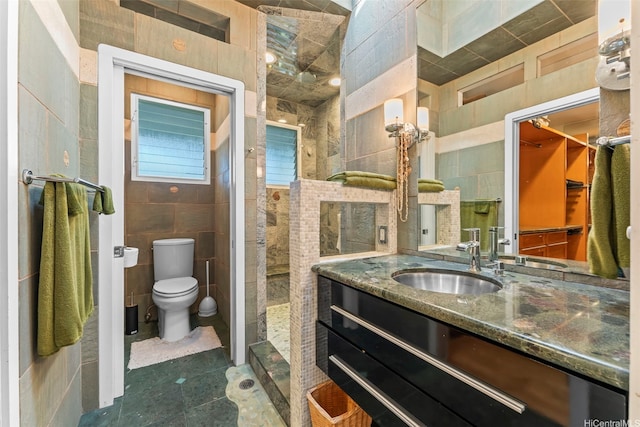 3233 Allan Pl, Honolulu, HI 96817 - bathroom featuring tile walls, vanity, walk in shower, and tile patterned floors