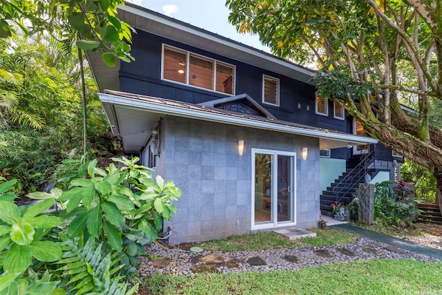 3233 Allan Pl, Honolulu, HI 96817 - rear view of house featuring concrete block siding and stairs