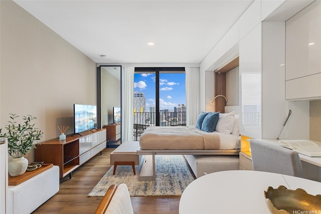 987 Queen St Unit 3209, Honolulu, HI 96814 - living room with dark wood-style floors, expansive windows, and recessed lighting