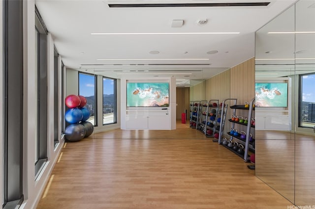 987 Queen St Unit 3209, Honolulu, HI 96814 - exercise area with light wood-type flooring, expansive windows, and healthy amount of natural light