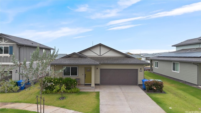91-1725 Kapeku Loop, Ewa Beach, HI 96706 - view of front of house featuring an attached garage, driveway, a front yard, and roof with shingles