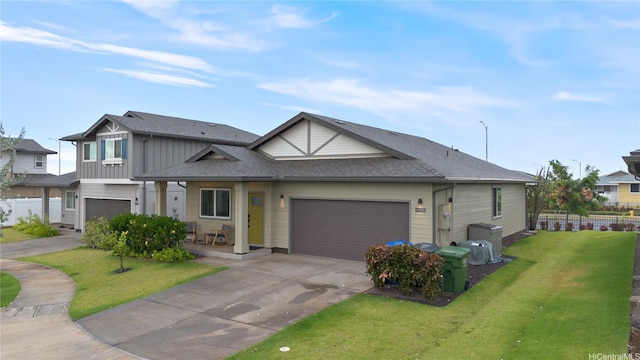 91-1725 Kapeku Loop, Ewa Beach, HI 96706 - view of front of house featuring driveway, a shingled roof, an attached garage, and board and batten siding