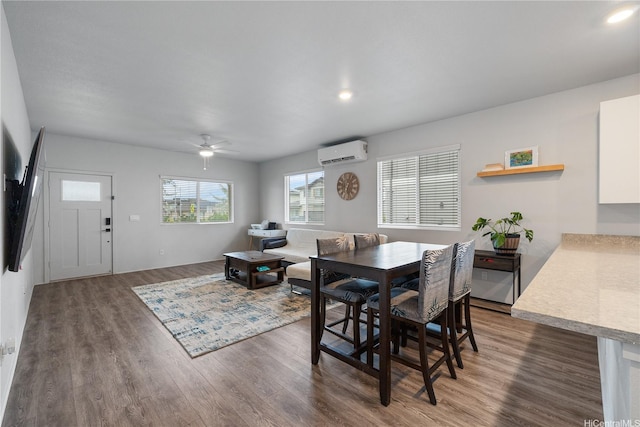 91-1725 Kapeku Loop, Ewa Beach, HI 96706 - dining space featuring an AC wall unit, wood finished floors, and ceiling fan