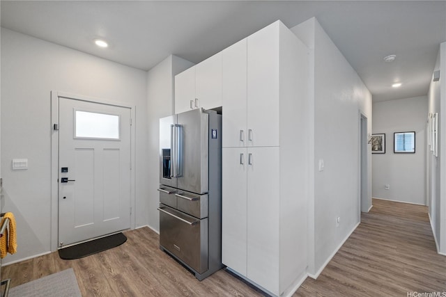 91-1725 Kapeku Loop, Ewa Beach, HI 96706 - kitchen featuring high quality fridge, wood finished floors, white cabinets, and recessed lighting
