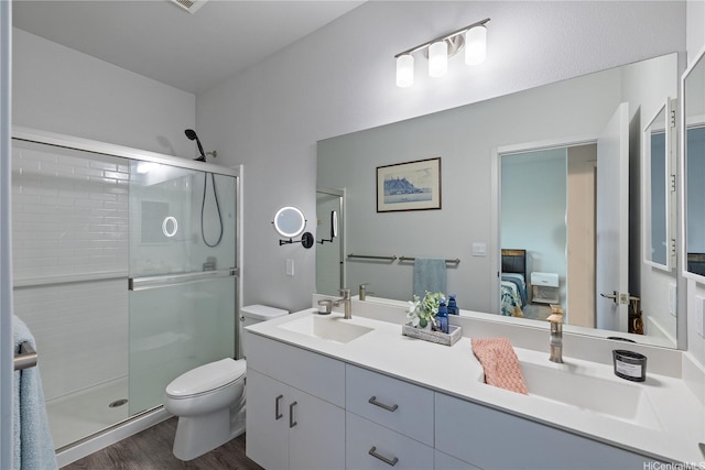 91-1725 Kapeku Loop, Ewa Beach, HI 96706 - full bathroom featuring a stall shower, double vanity, ensuite bath, and wood finished floors